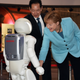 Image for article titled Why Is Angela Merkel Always Palling Around With Robots?